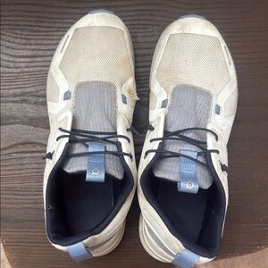 On Running Cream and Gray Sneakers with Minimalist Design